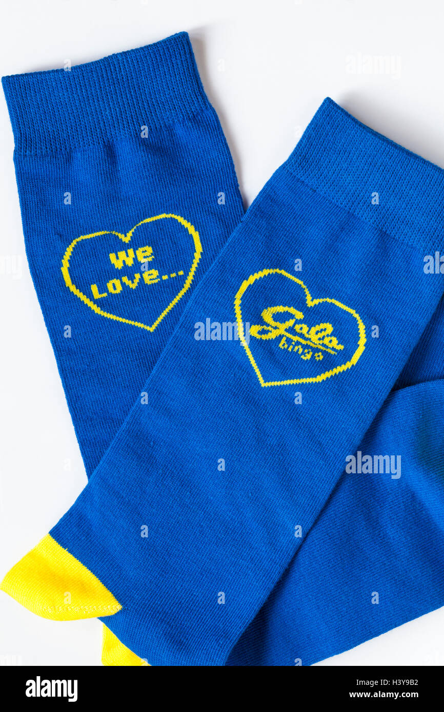 Bingo prize - Gala Bingo blue and yellow socks we love gala bingo on white background Stock Photo