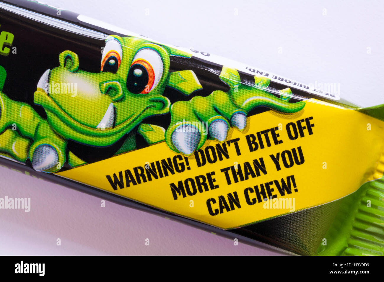 Warning don't bite off more than you can chew - detail on pack of Xtreme Chewits extremely sour apple Stock Photo