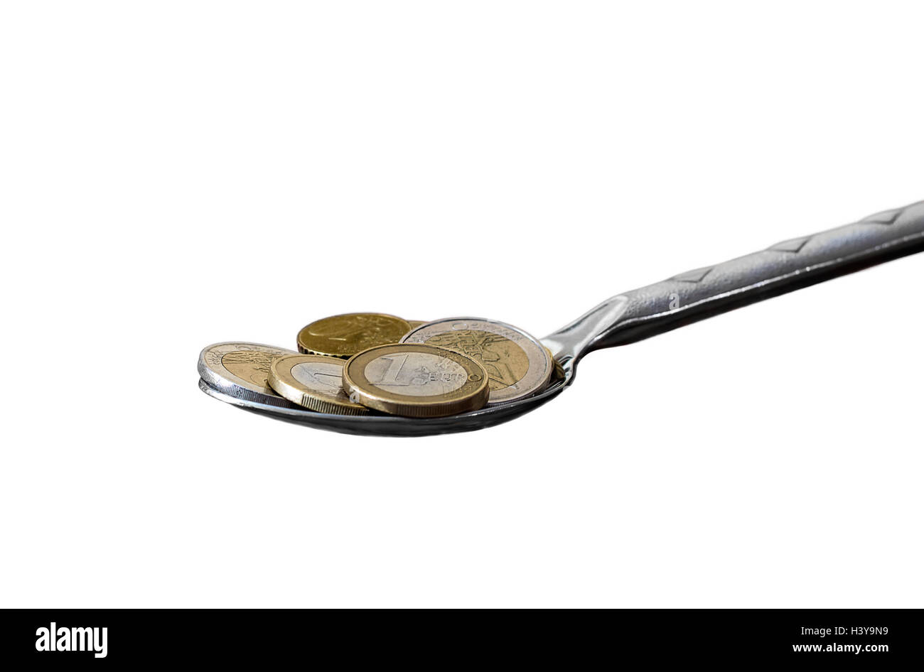 Spoon full of euro coins isolated on a white background Stock Photo - Alamy