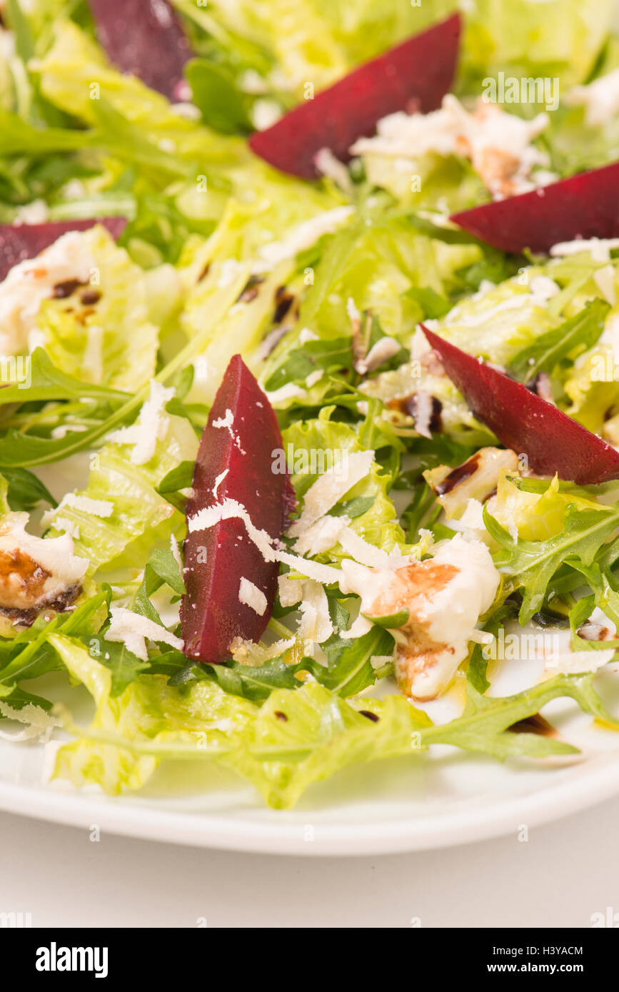 Salad with beetroot in close up. Healthy diet food with vegetables. Served on a plate as vegetarian meal or appetizer. Stock Photo