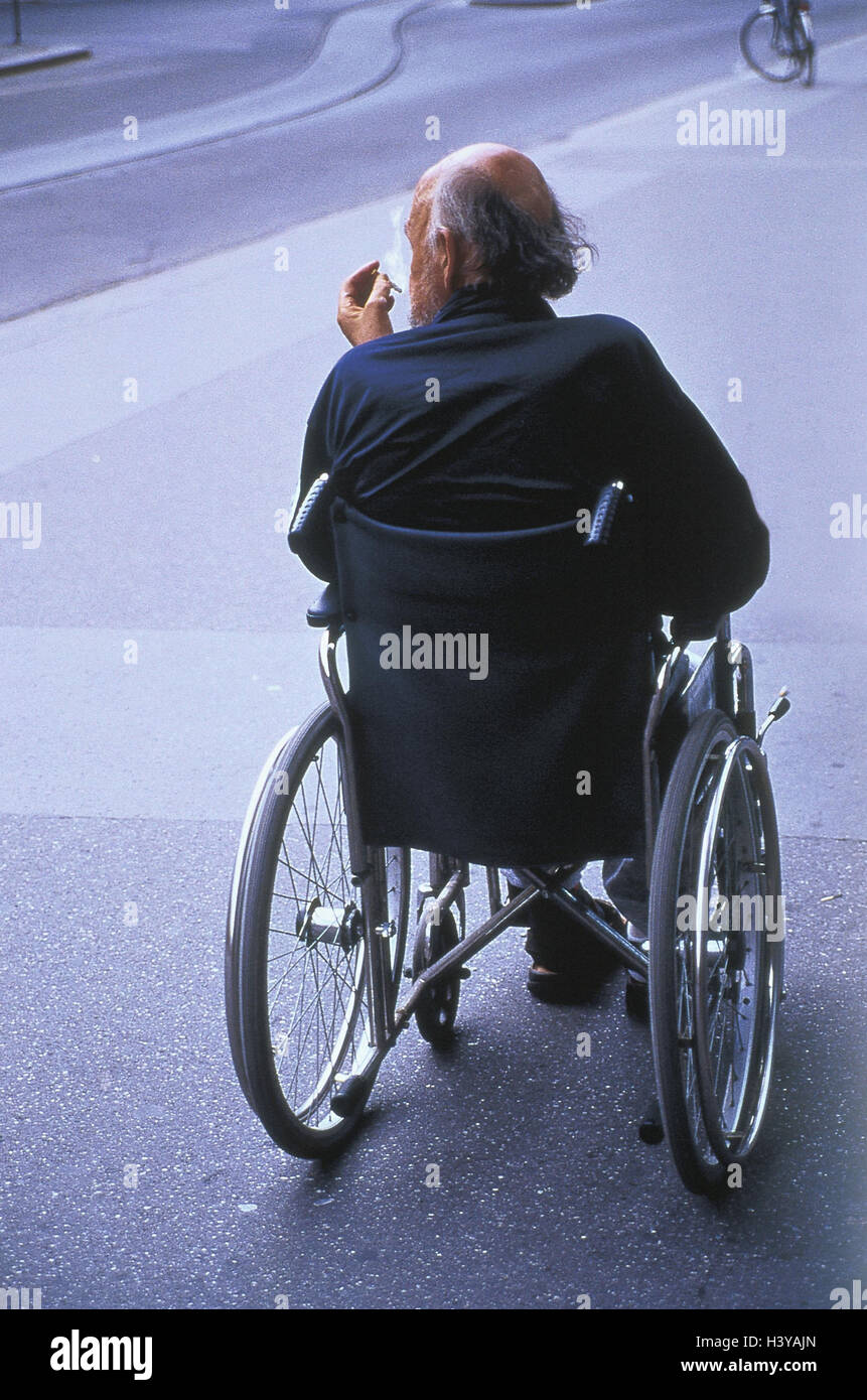 Street, invalid's wheel chair driver, cigarette, smoke, back view, outside, summers, asphalt road, cigarette, smoke, disabled person, Handicapped, walking-hindered, man, senior, nicotine, mania, invalid, wheel chair, Stock Photo