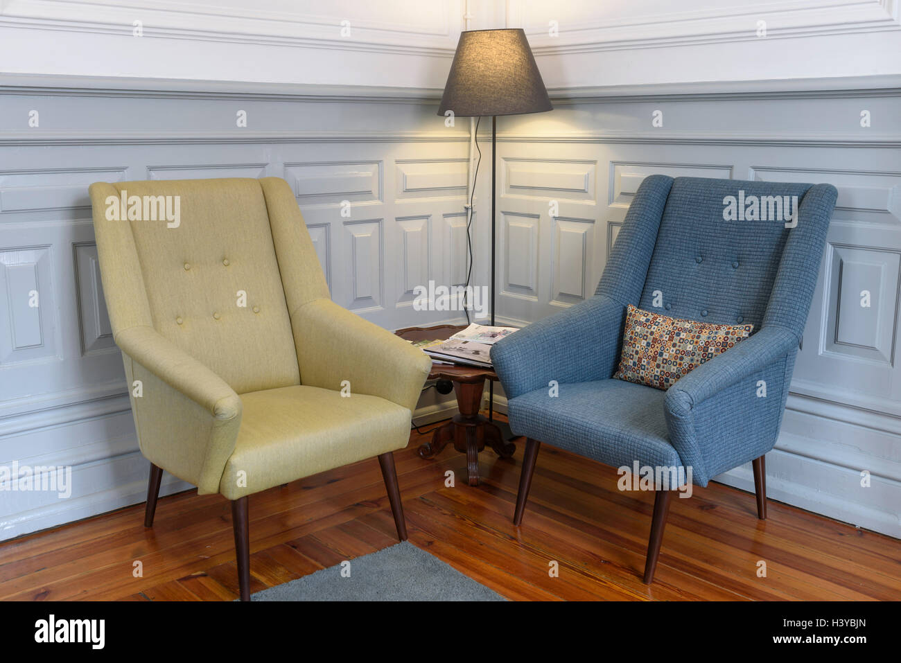 Two armchairs and a floor lamp on a reading corner Stock Photo