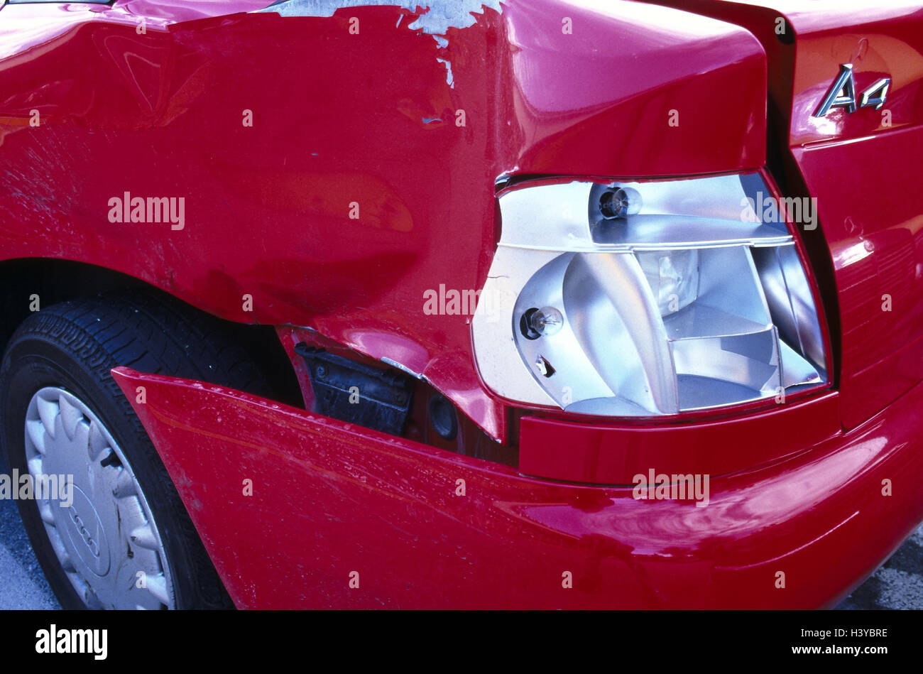 Ambulance, red, rear view, detail, damage to the bodywork, accident