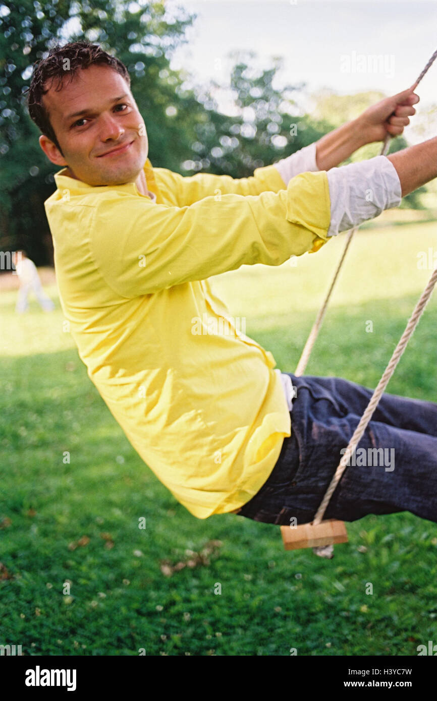 Man, young, swing, leisure time, fun, amusements, joy, swing, happy, cheerfully, melted, lighthearted, childishly, carefree, casually, summer, outside Stock Photo