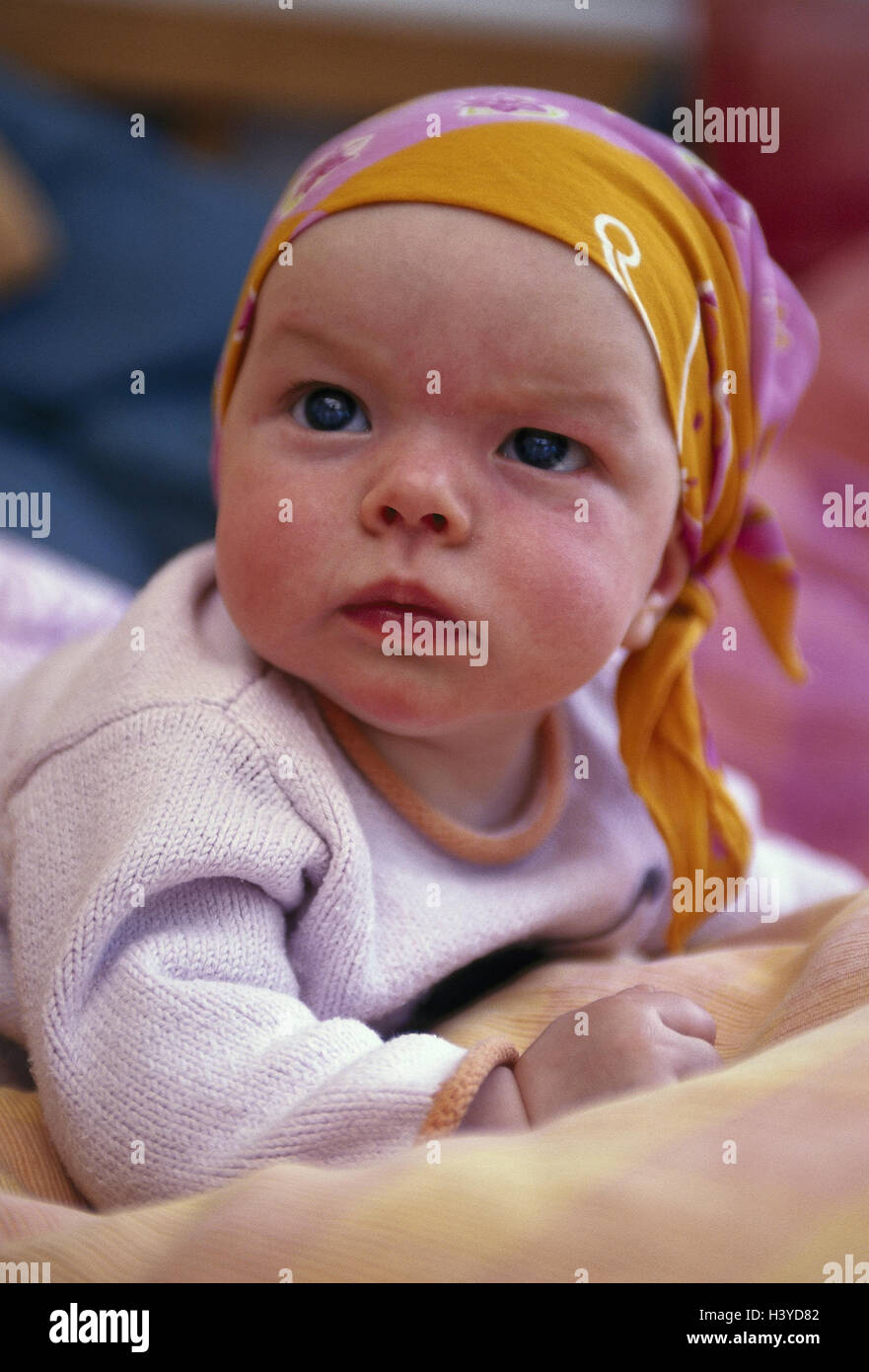 Baby, headscarf, abdominal position, doubtfully, very close, inside, child, infant, headgear, expression, scepticism, seriously, dissatisfied, discontent, unhappily Stock Photo