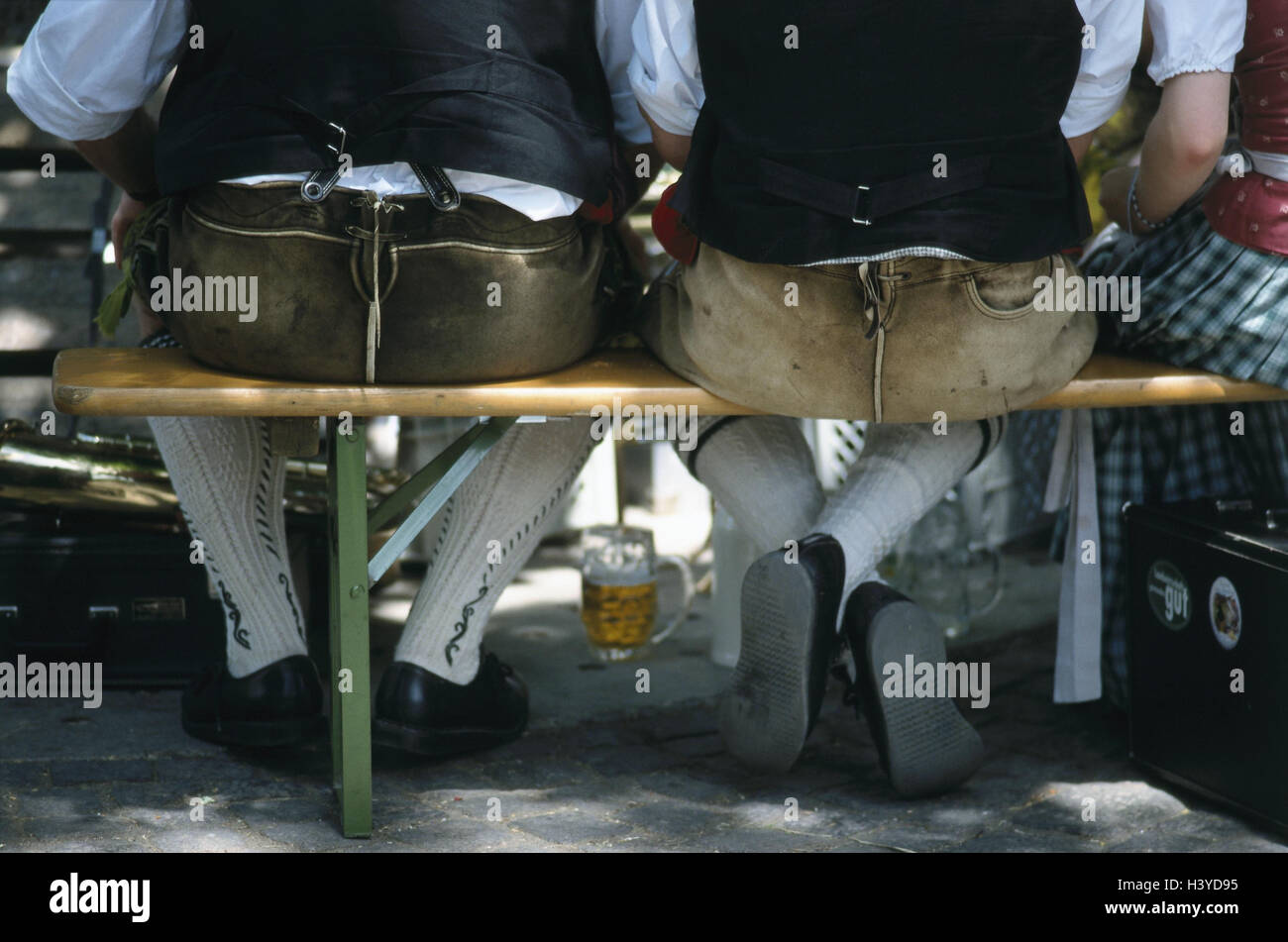 Beer garden, bank, men, leather ball trousers, sit, detail, outside, summer, summery, national costumes, folklore, folklore clothes, leisure time, leather ball trousers Stock Photo
