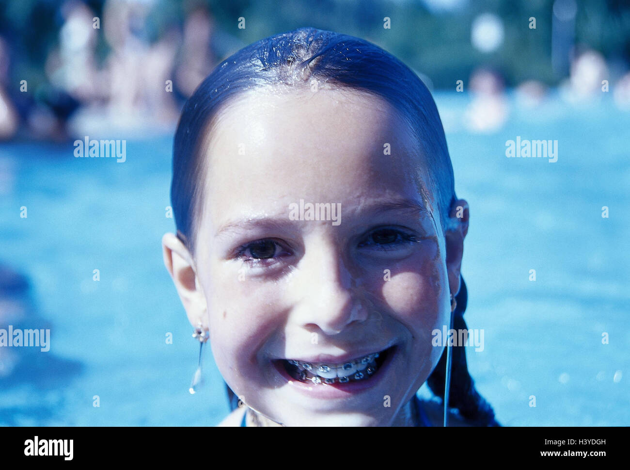 Outdoor swimming pool, girl, hairs wet, brace, laugh, portrait, child, summer, leisure time, holidays, bath pass, swimming-pool, outside cymbal, child, water, happy, cheerfully, cheerfulness, braces, orthodontic treatment, Brackets, teeth regulation, dent Stock Photo
