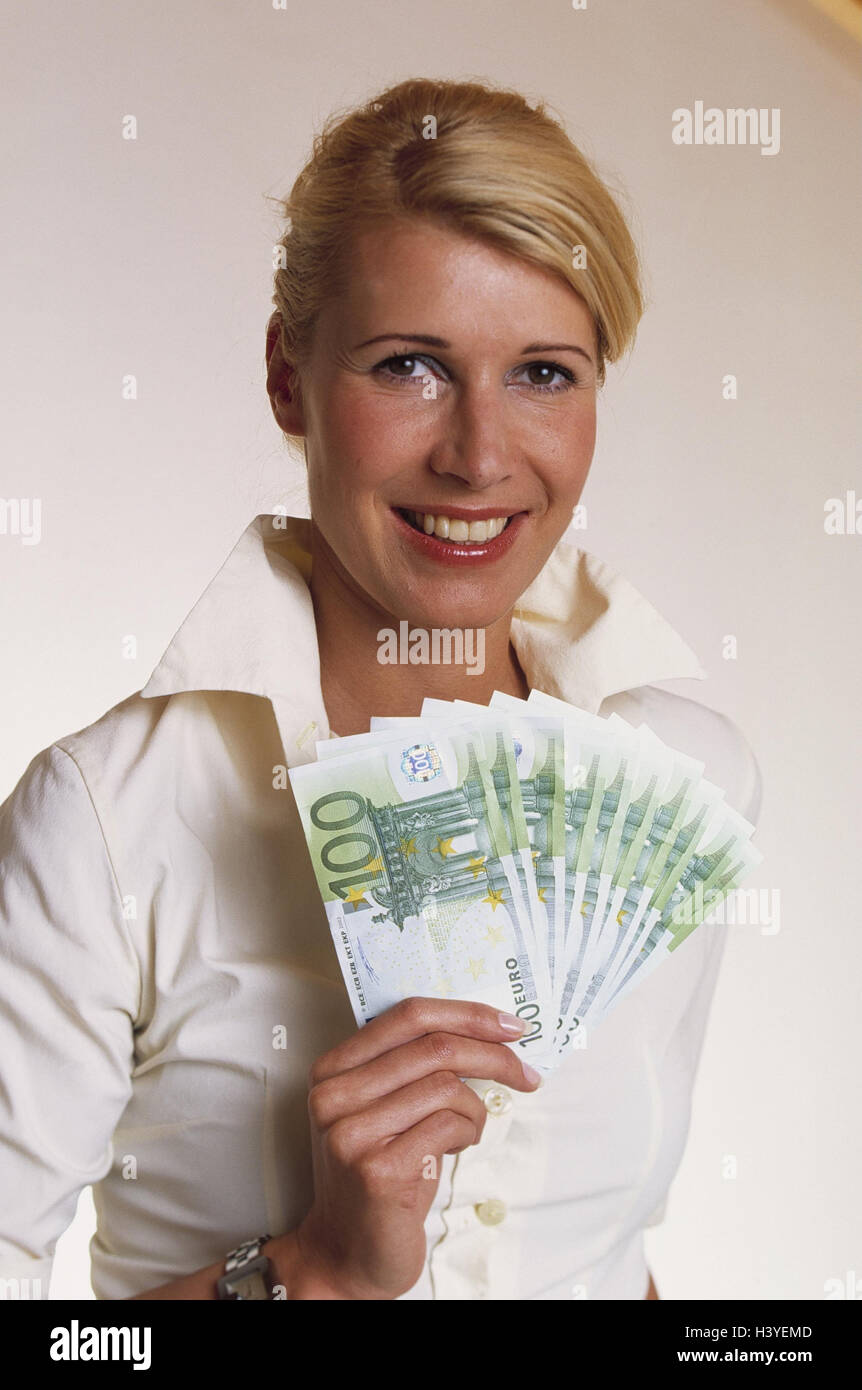 Woman, happy, banknotes, diversified, half portrait, studio, young, smile, cheerfulness, expression, notes, taking, income, incomes, money, euro, euronotes, savings, savings, means payment, currency, single currency, Hundred euro banknotes Stock Photo