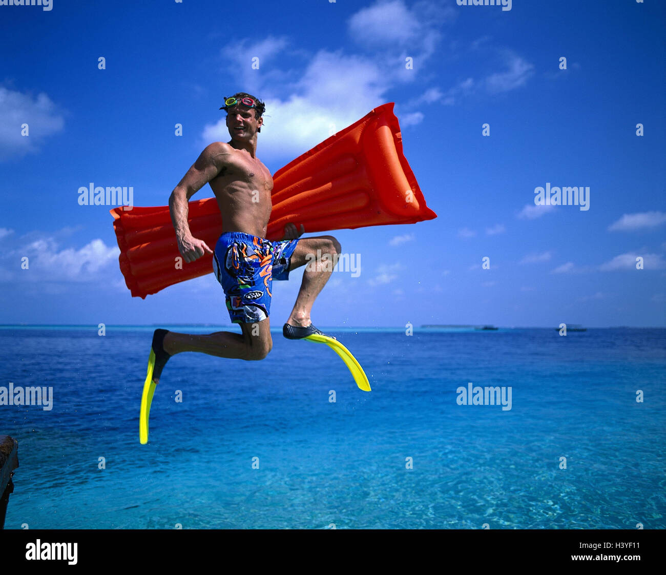Sea, man, swimming fins, air bed, gesture, caper, outside, young, swimming trunks, snorkel equipment, jump, crack, happy, snorkel, leisure time, hobby, beach holiday, vacation, rest, joy, water Stock Photo