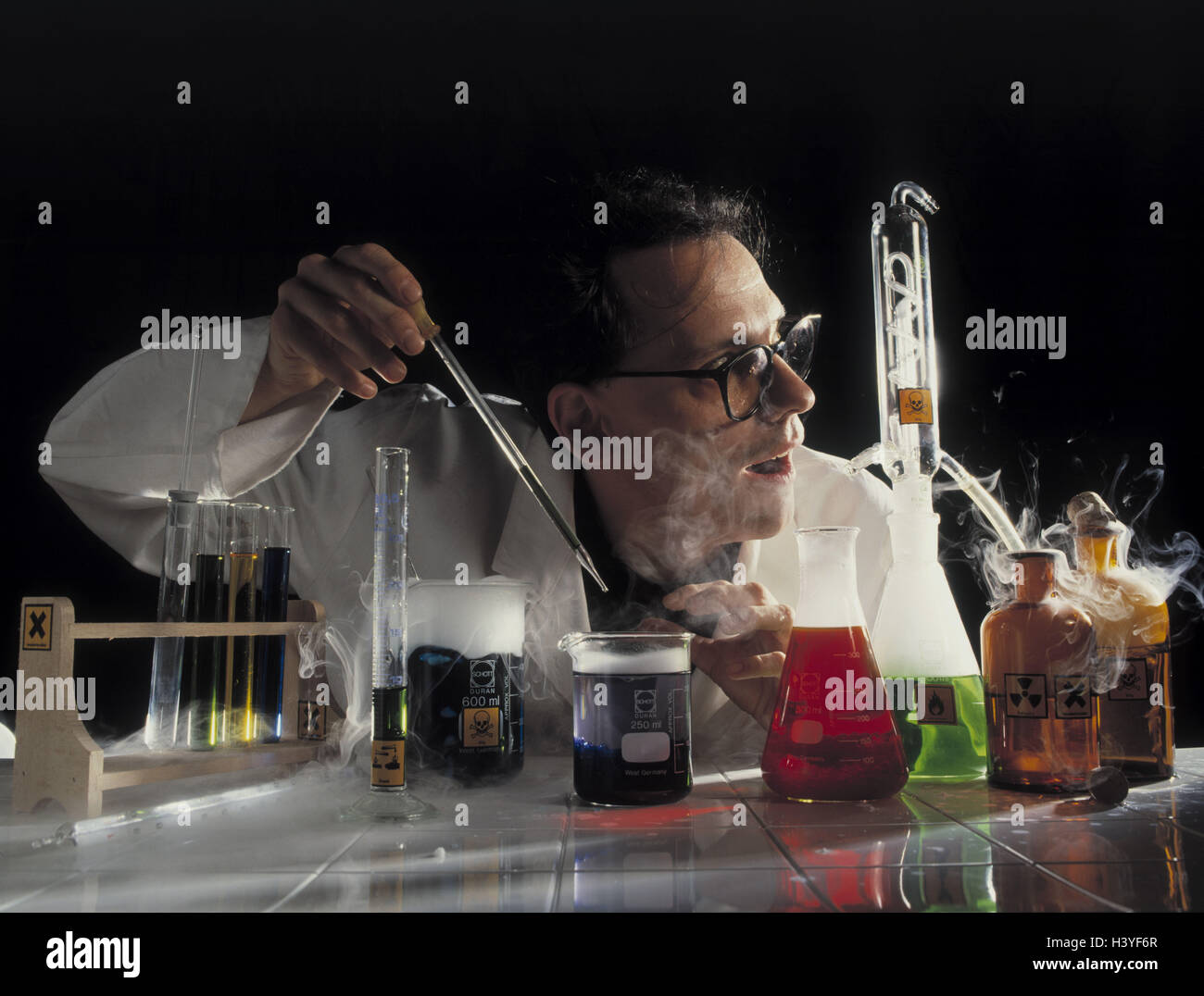 Laboratory, chemist, attempt, facial play, astonishment inside, chemistry, chemically, begin, reaction, observe, glass Bottles, liquid, liquids, laboratory vessels, test liquids, brightly, chemicals, look, surprises, entrancedly, scientists, science, research, differently, occupation, chemical laboratory, work, work, experiment Stock Photo