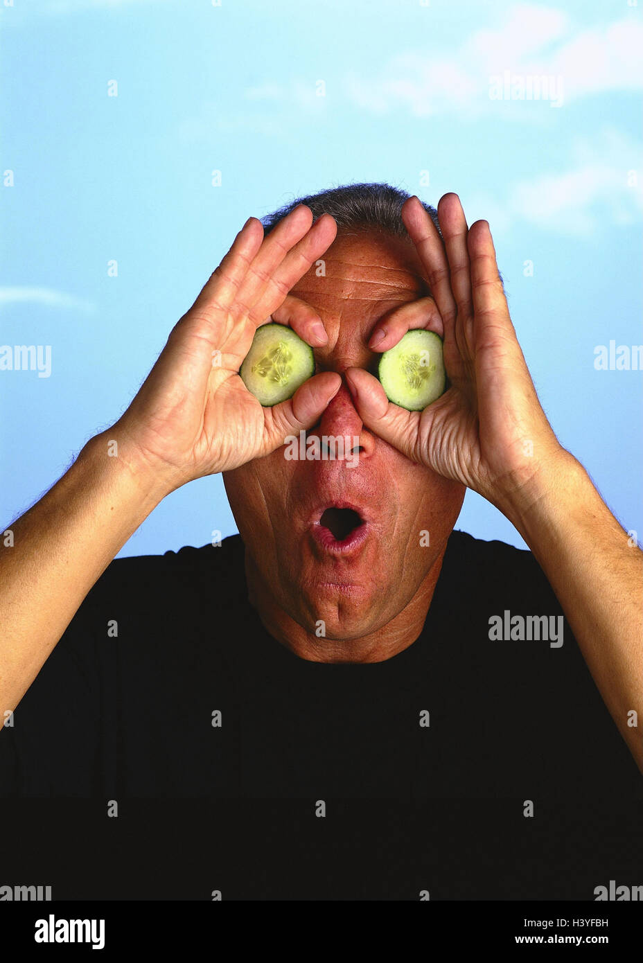 Man, eyes, cucumber slices, gesture, frighten, portrait, outside, middle old person, cucumber, grimace, cut outs, stupidly, nonsense, humor, gag, cheerfulness, joke, funnily, joke, fun, amusement, astonishment, surprise Stock Photo