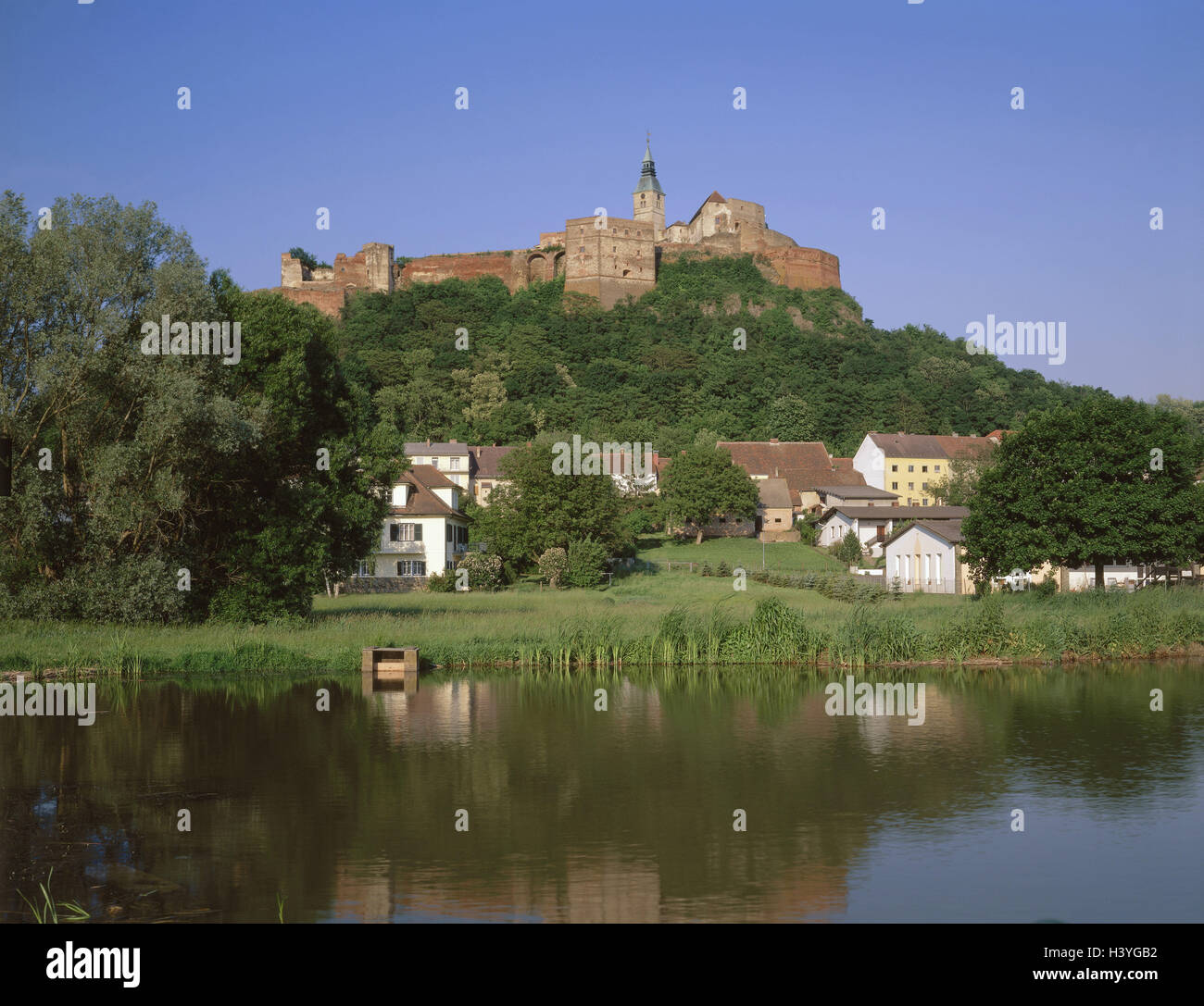 Austria, Burgenland, Güssing, local view, Europe, place, houses, residential houses, hills, castle defensive walls, castle, cloister, Franciscan's cloister, structure, architecture, place of interest, lake, waters Stock Photo