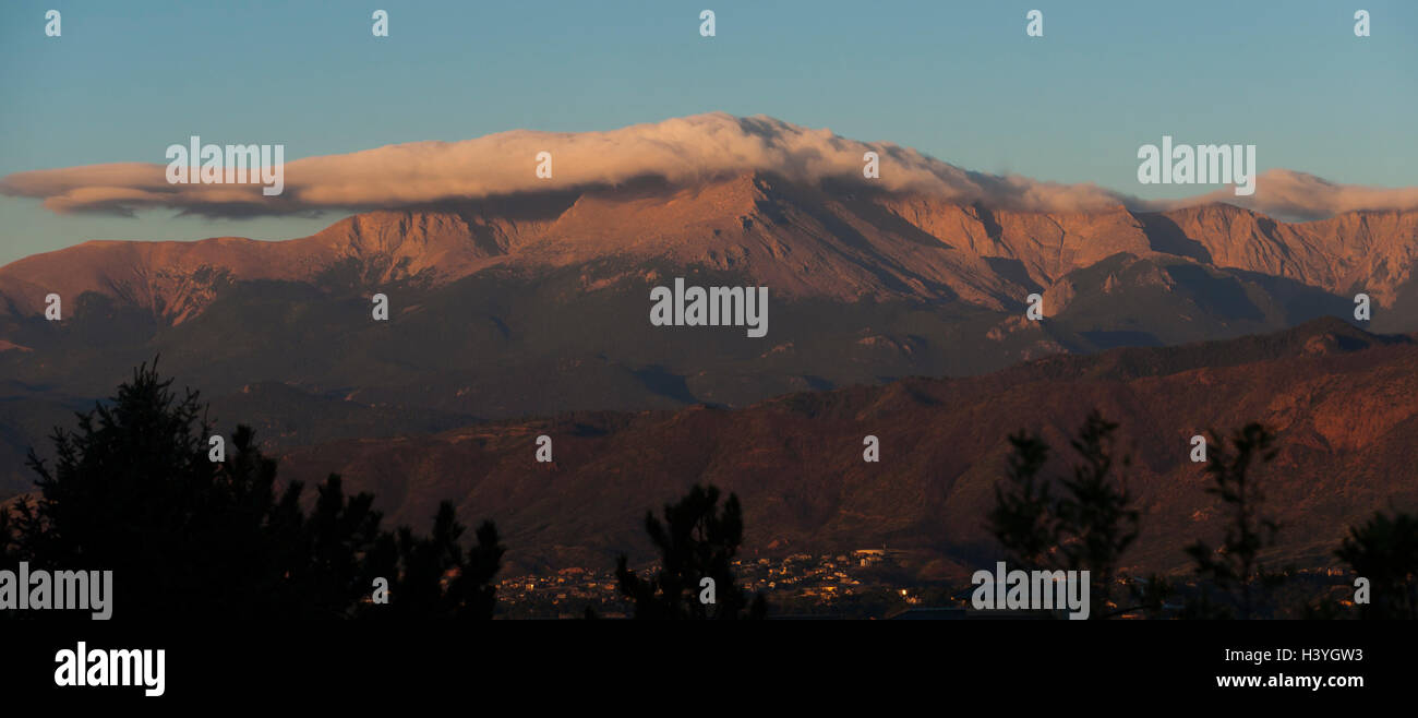 Pikes Peak in Colorado Springs, Colorado is illuminated in the light of