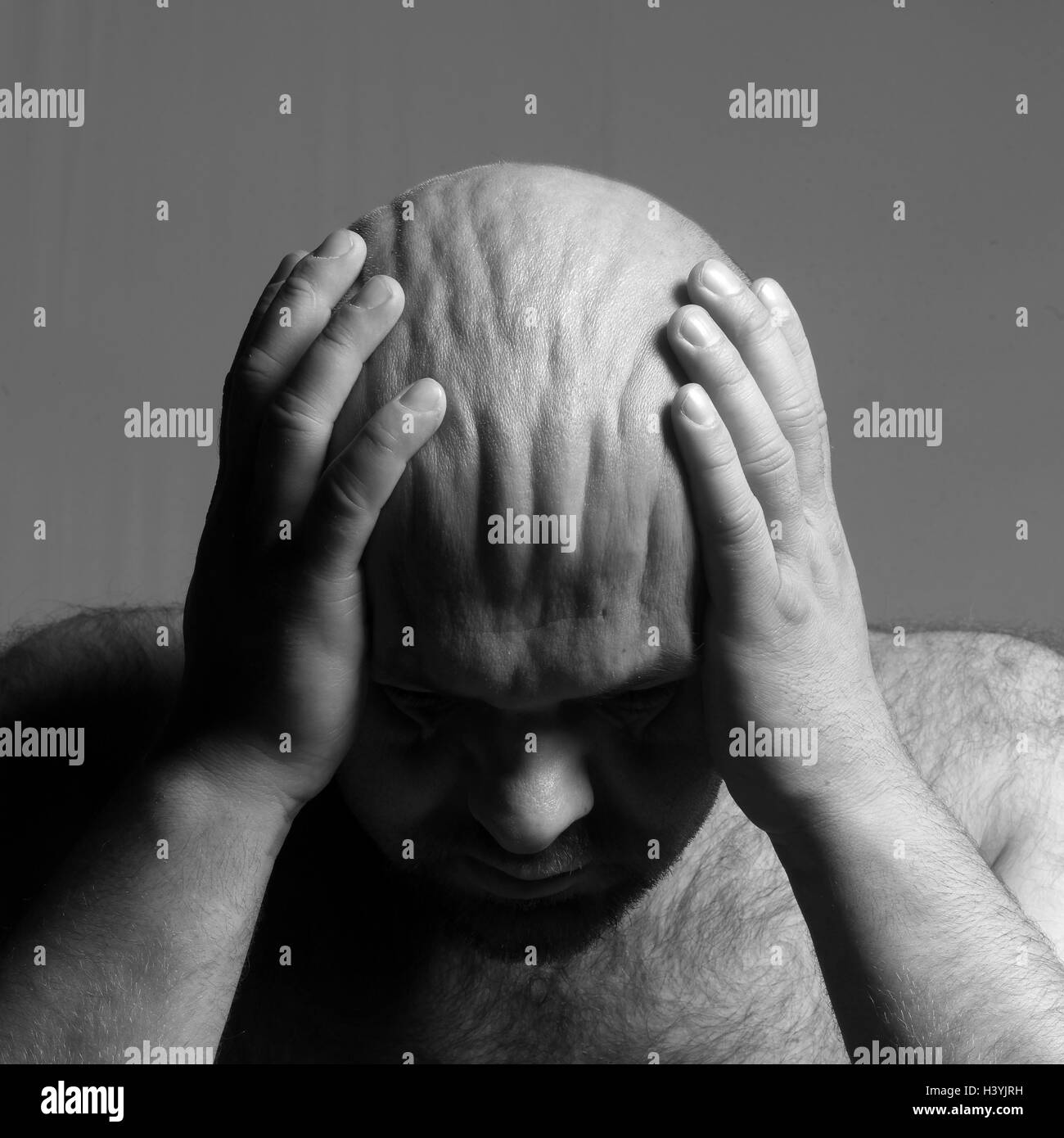 Man, bald head, hands, scalp, pleats, gesture, despair, helplessness, b/w Stock Photo