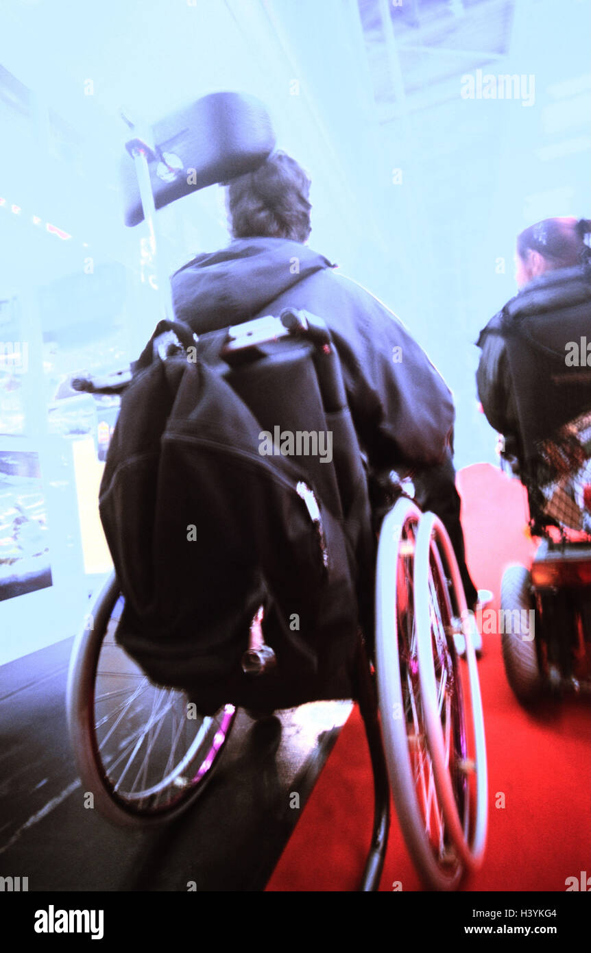 Invalid's wheel chair driver, two, back view, blur, Ti7, people, invalid, wheel chair, wheel chairs, impediment, walking-hindered, hinders, in need care, walking impediment, physical disability, paralyzed, accessory, locomotion, mobility, independency, in Stock Photo