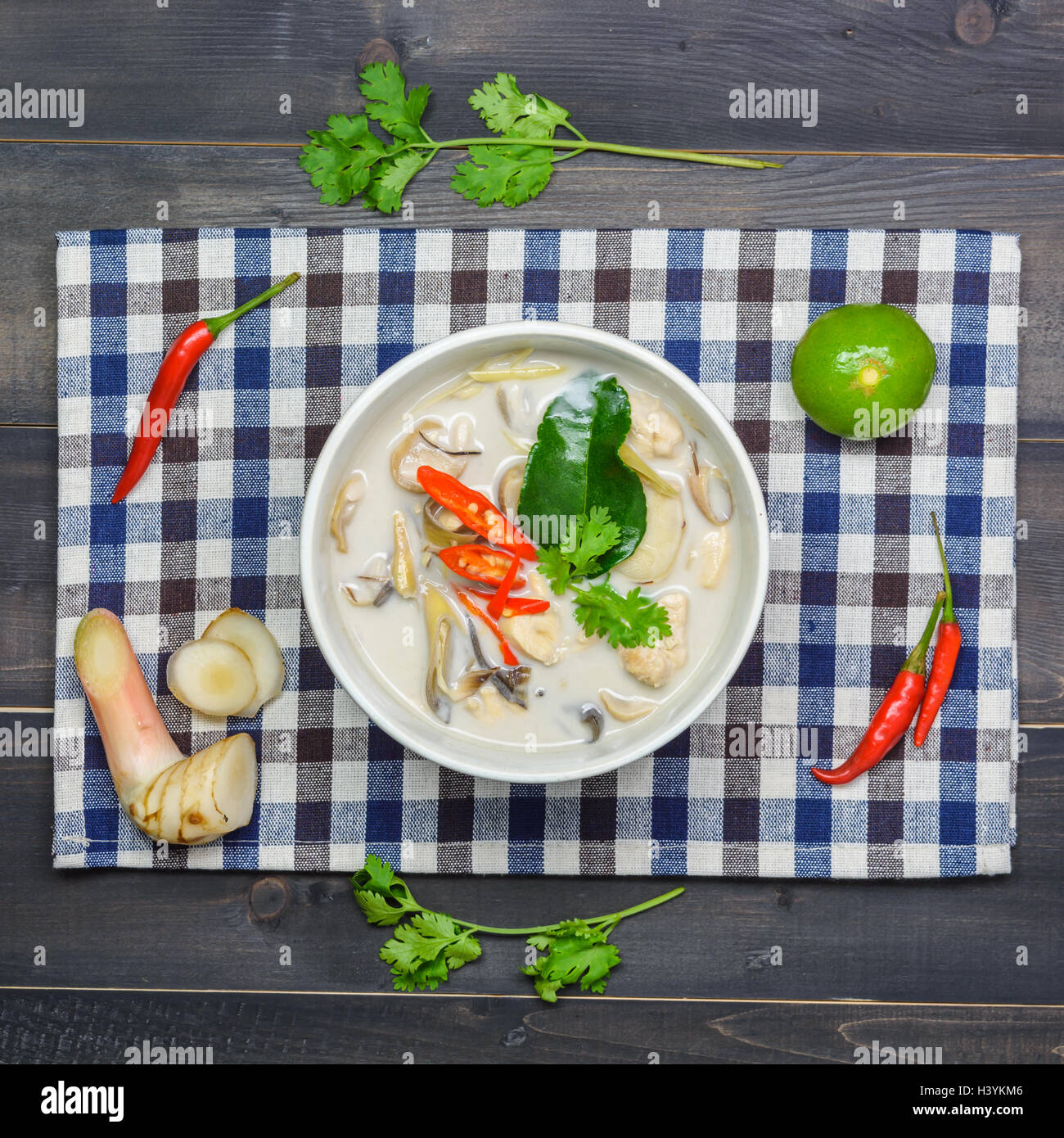 coconut milk soup with chicken or Thai chicken coconut Soup ( Tom Kha Gai ) on wooden table top view, Thai local food Stock Photo