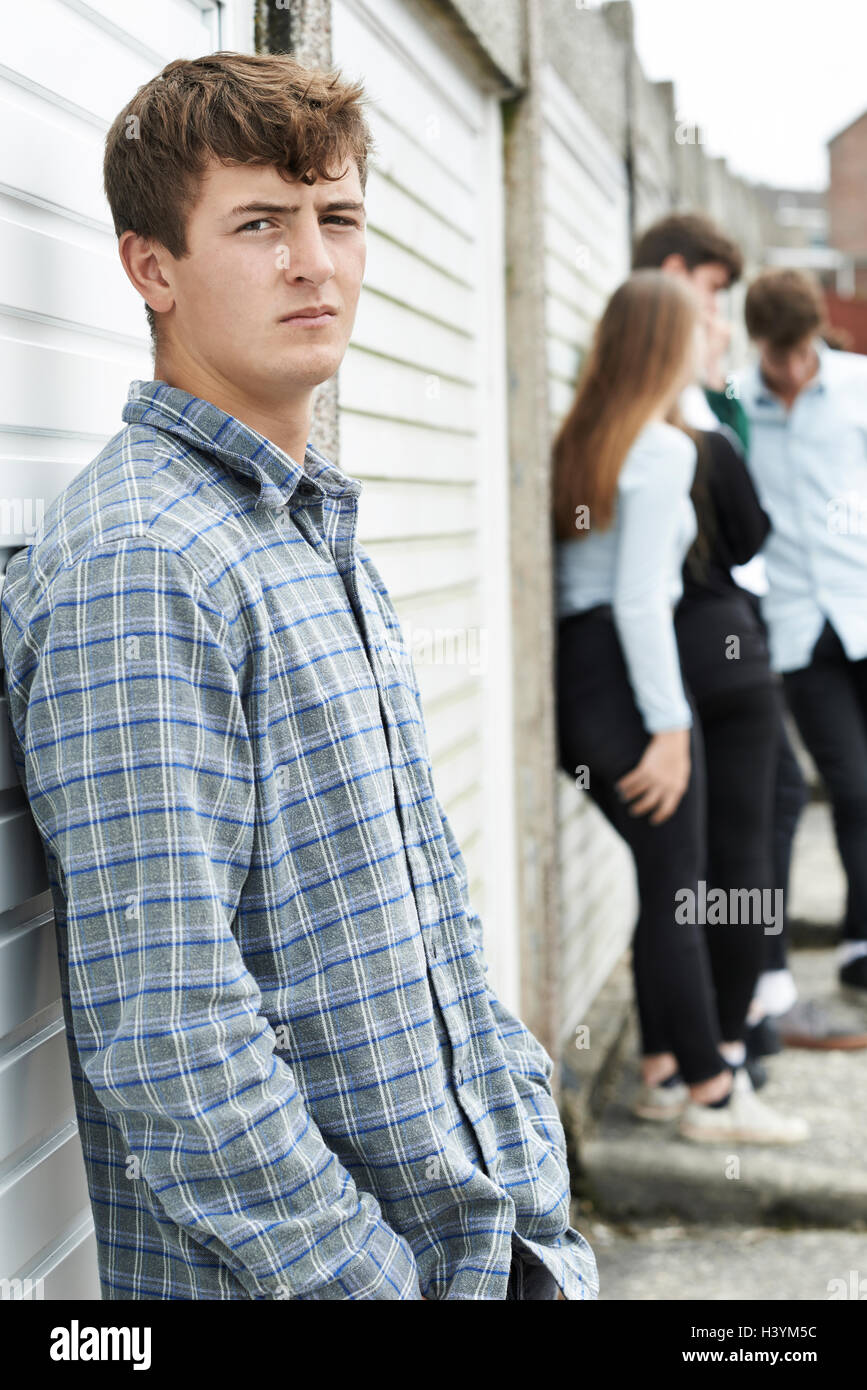 Gang Of Teenagers Hanging Out In Urban Environment Stock Photo