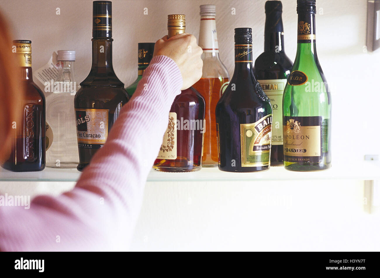 Woman, detail, arm, shelf, flasks, spirits, differently, select
