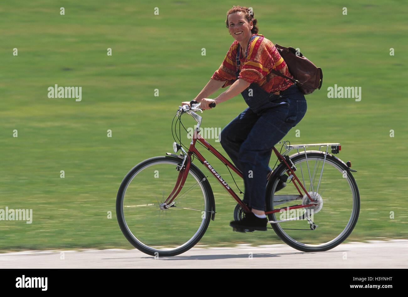 Woman pregnant riding bike side hires stock photography and images Alamy