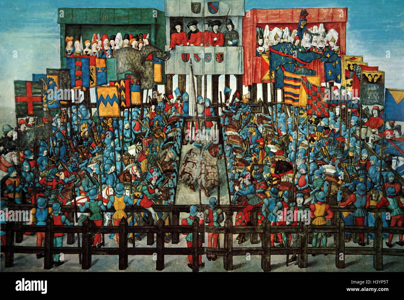 Illumination depicting a medieval tournament. The knights hold colourful banners and face each other preparing to confront each other. Dated 15th Century Stock Photo