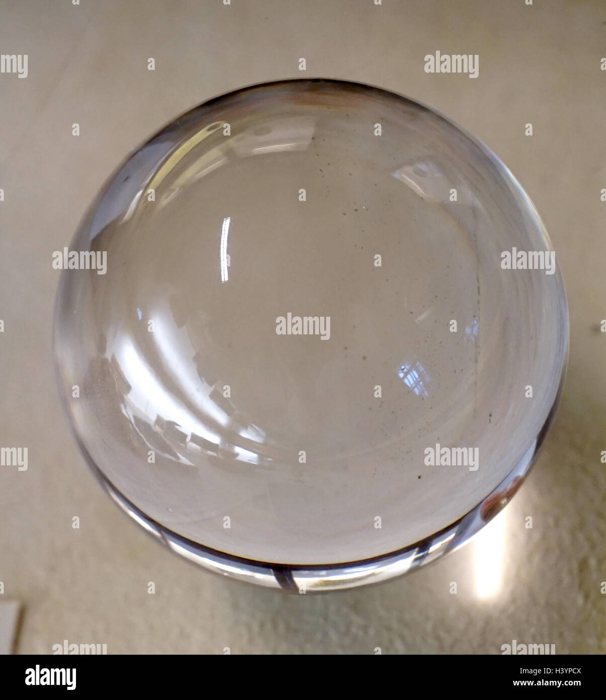 A crystal ball fashioned from quartz which has been polished, which a common fortune telling object. Dated 20th Century Stock Photo