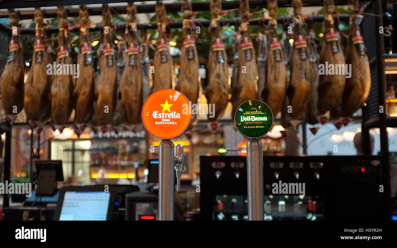 typical bar with jamon (ham) hanging from bar, in barcelona Stock Photo
