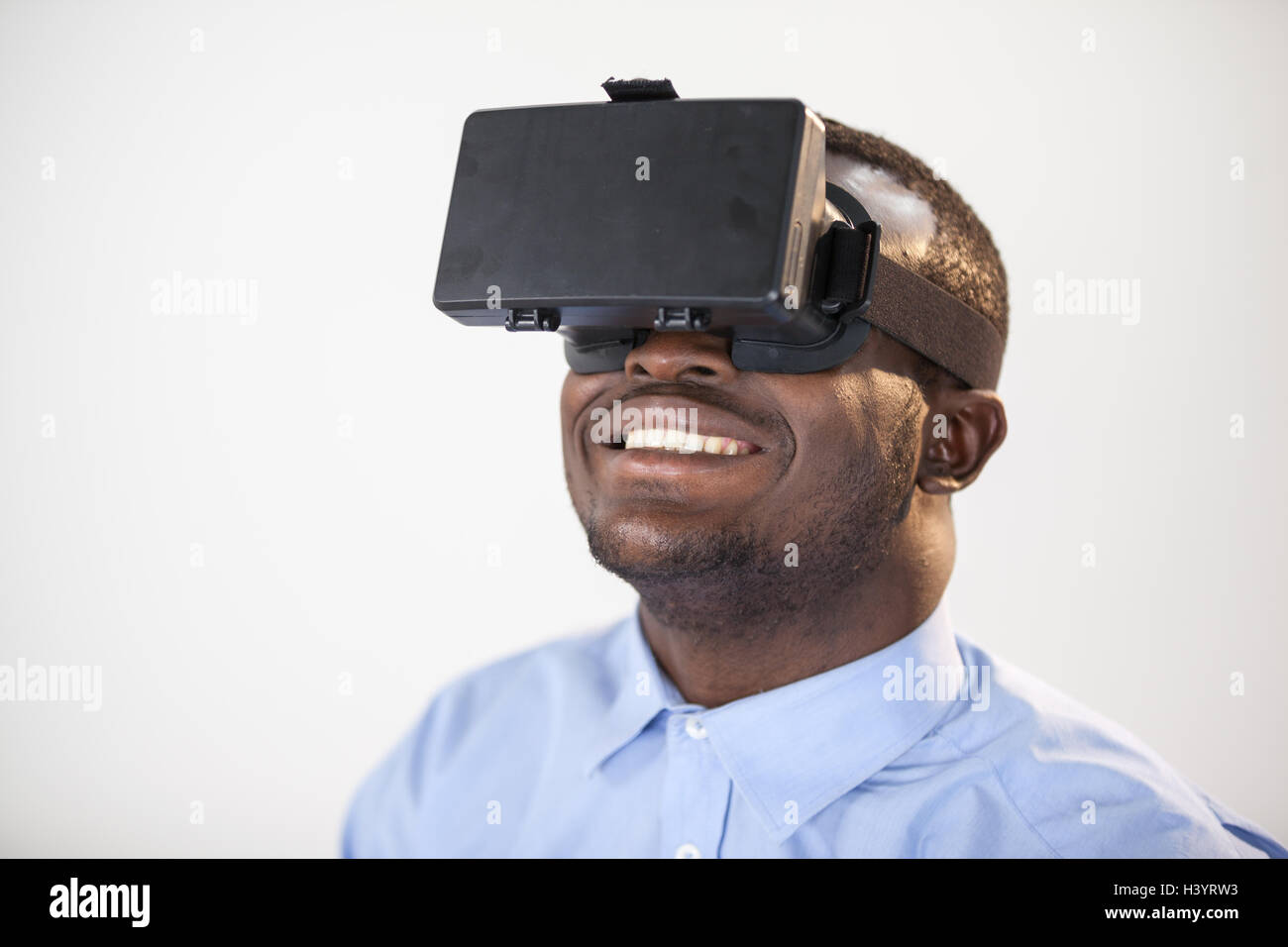 Man using virtual reality headset Stock Photo - Alamy