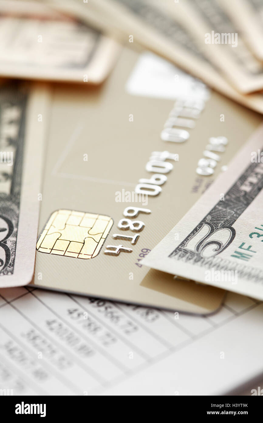 Credit card near money on paper background with digits Stock Photo Alamy