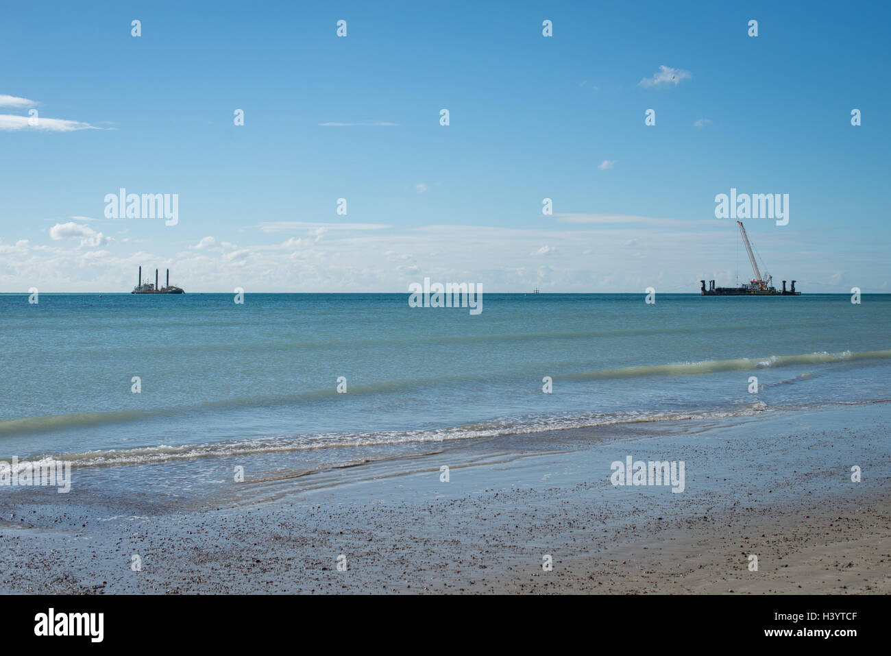 A large construction vessel works out at sea on the site of the new Rampion Wind Farm in Lancing, West Sussex, England. Stock Photo