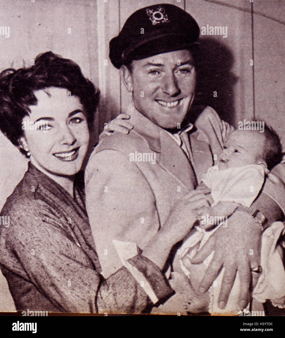 Photograph of Michael Wilding (1912-1979) his wife Elizabeth Taylor (1932-2011) and their infant son Christopher Edward Wilding (1955-). Dated 20th Century Stock Photo
