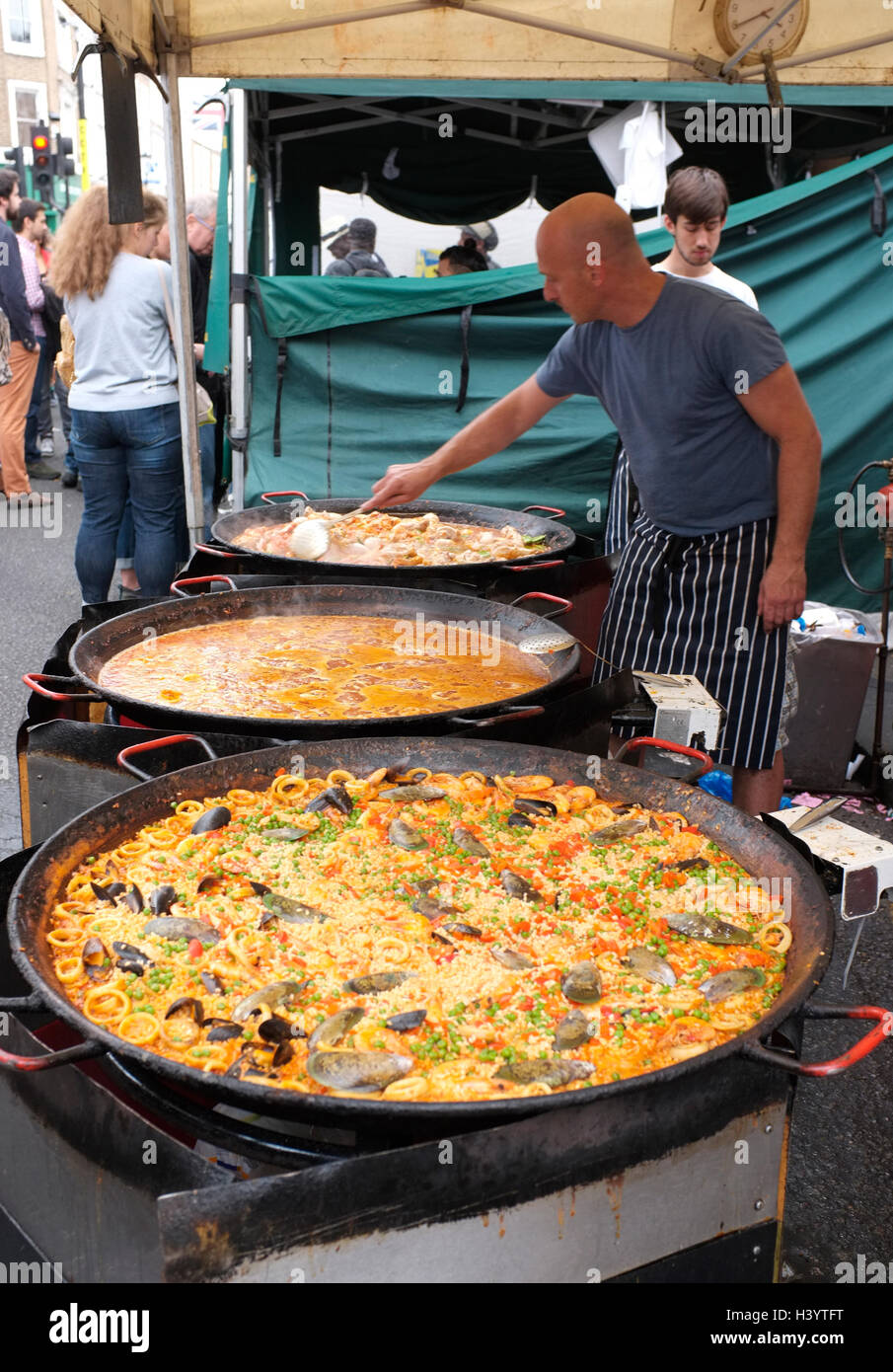 Huge Pans. Cooking Paella Valenciana. Italy Street Food 