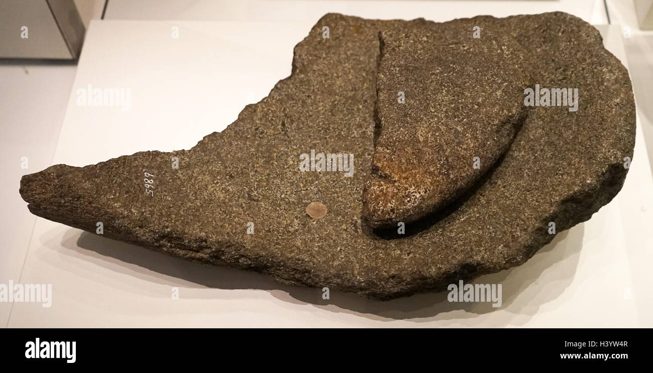 Saddle quern with rubbing stone used for grinding corn. From Wales