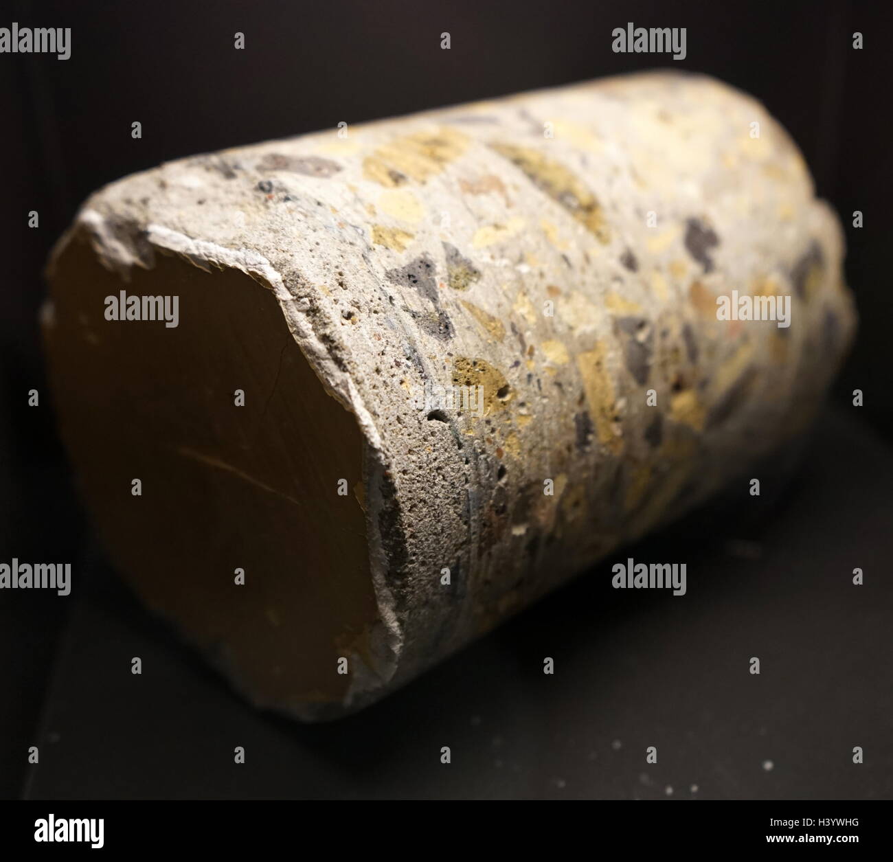 Sample of natural concrete, made from fragmented rock with deposited