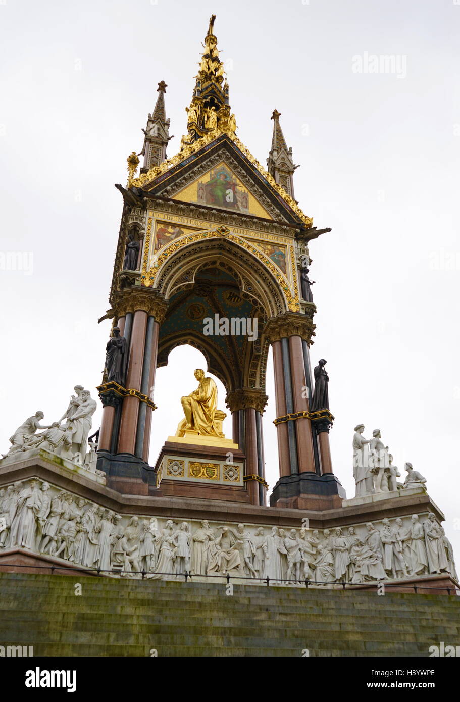 The Albert Memorial in Kensington Gardens, London. Commissioned by Queen Victoria in memory of her beloved husband, Prince Albert who died of typhoid in 1861. The memorial was designed by Sir George Gilbert Scott in the Gothic Revival style. Opened in July 1872 by Queen Victoria. Stock Photo