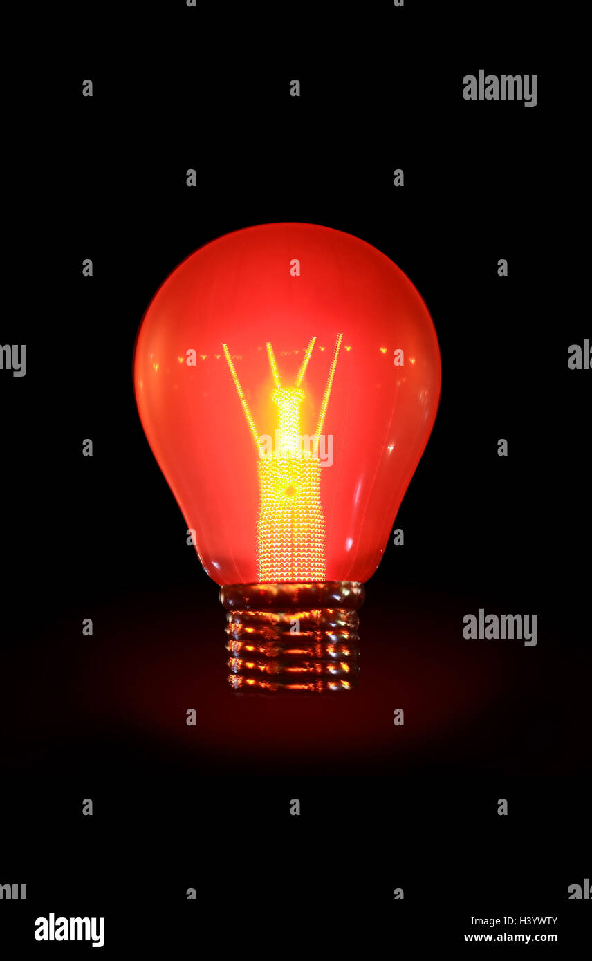 Glowing electric bulb on dark background Stock Photo Alamy