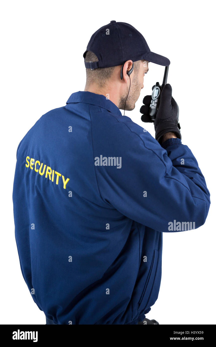 Security guard talking on walkie talkie hires stock photography and