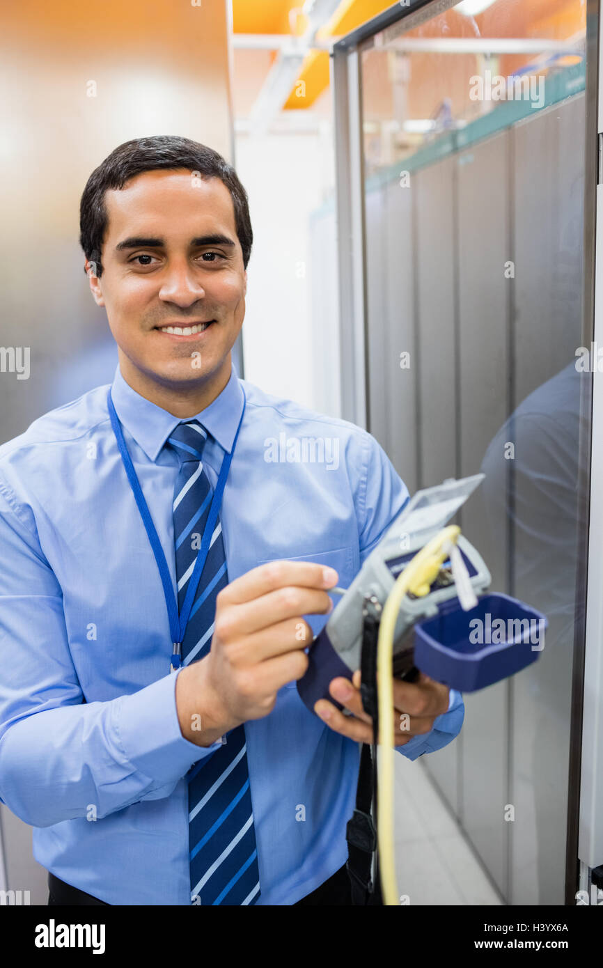 Portrait of technician using digital cable analyzer Stock Photo - Alamy