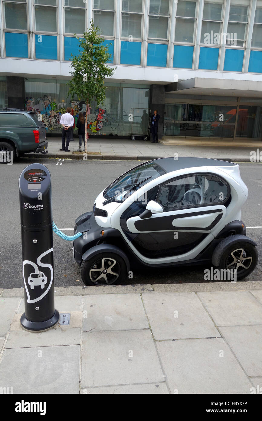 Electric car being charged at a road charging point, UK Stock Photo
