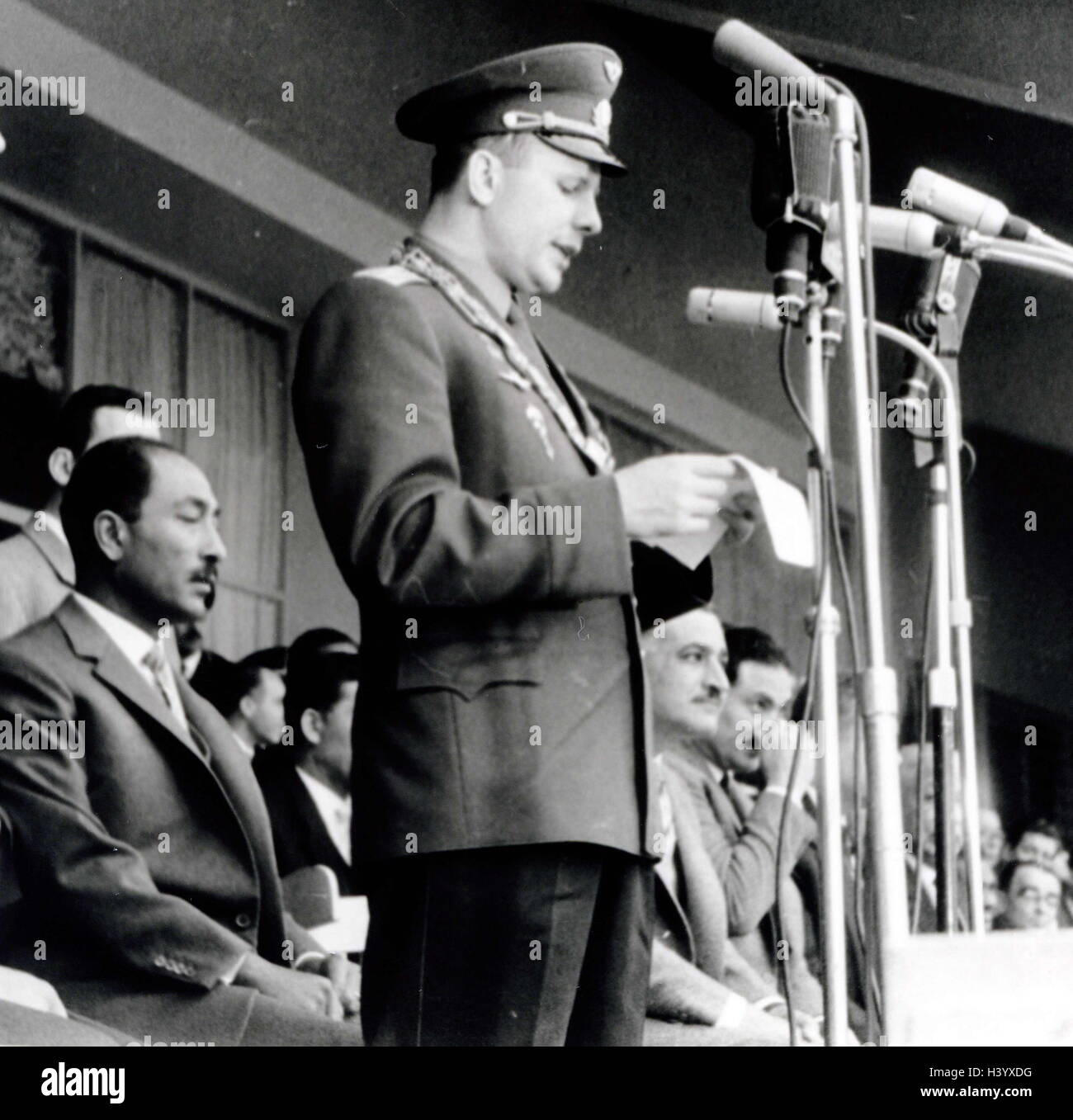 Photograph of Yuri Gagarin (1934-1968) a Russian cosmonaut, Gamal Abdel Nasser (1918-1970) President of Egypt, and Anwar El Sadat (1918-1981) President of Egypt, in a Stadium in Cairo, Egypt. Dated 20th Century Stock Photo