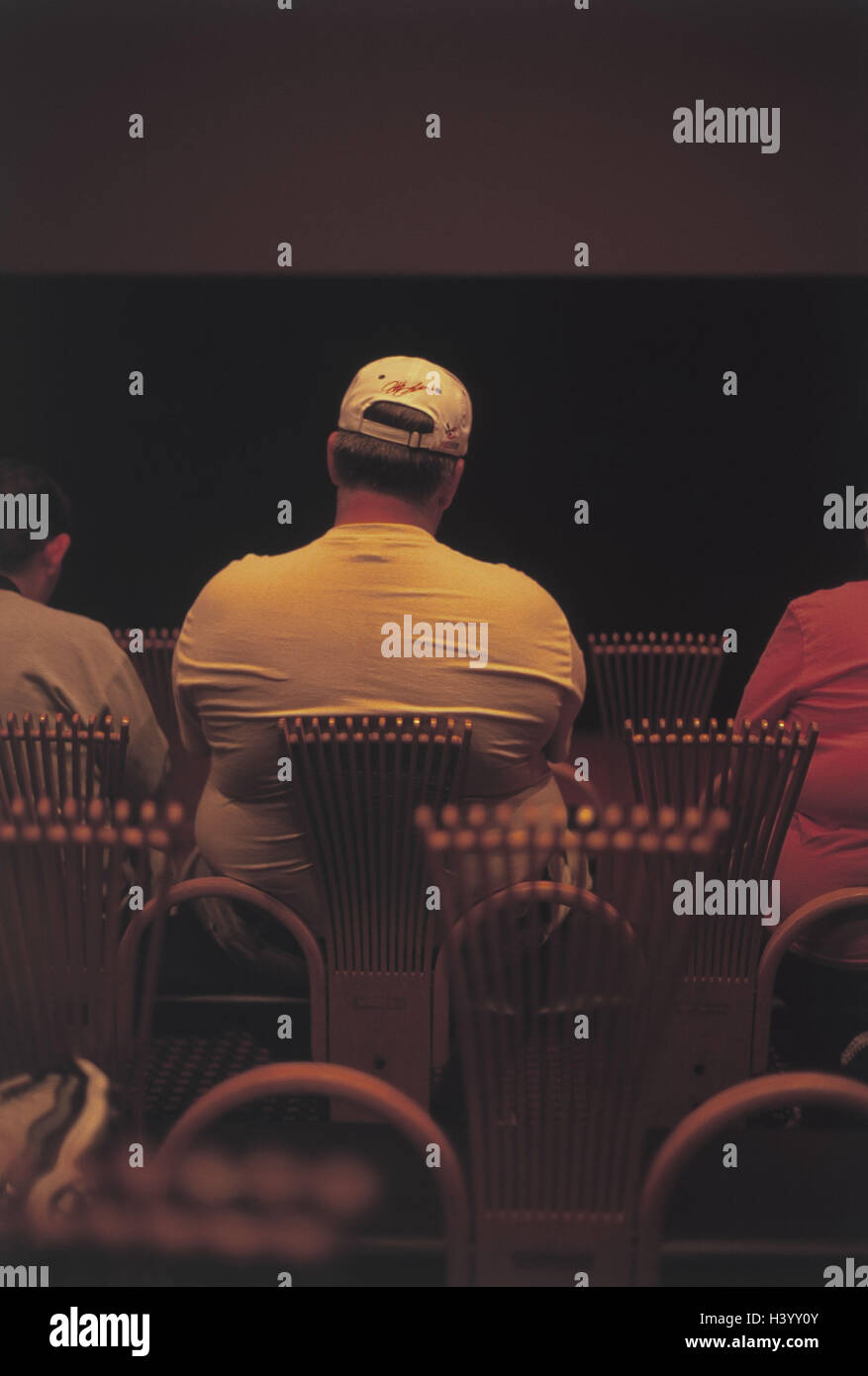 The USA, event, spectator, man, thickly, back view, America, rows, chairs, audience, sit, overweight, fat, bold, figure, figure's problems, adiposity, inside Stock Photo