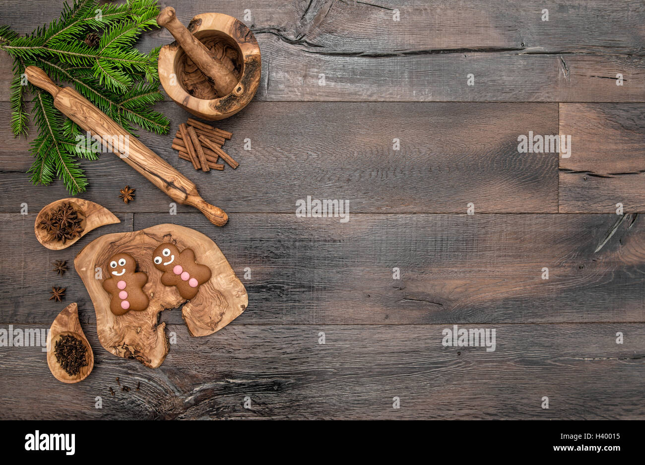 Christmas gingerbread man cookies, spices and baking tools. Holidays food background Stock Photo