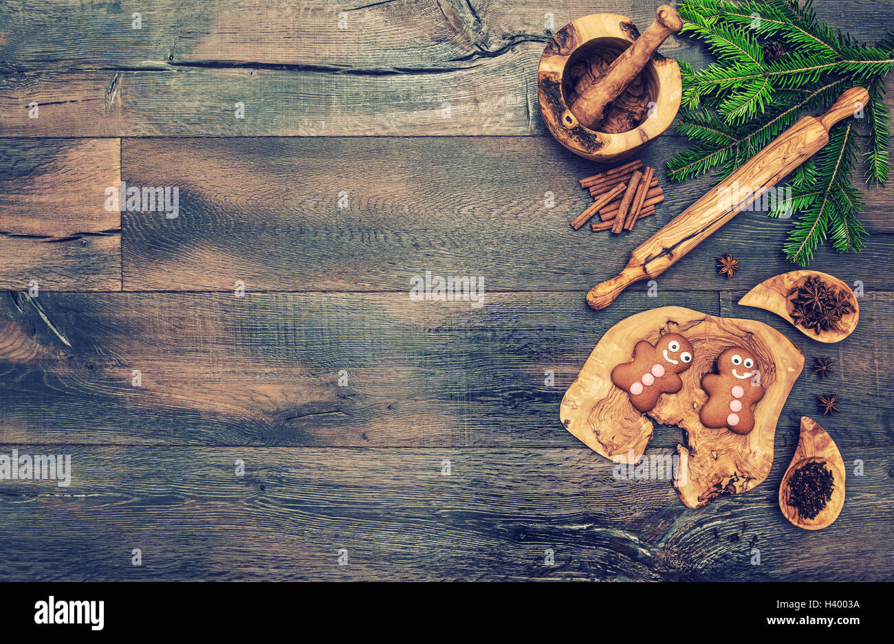 Christmas gingerbread cookie and baking tools. Retro style toned picture Stock Photo