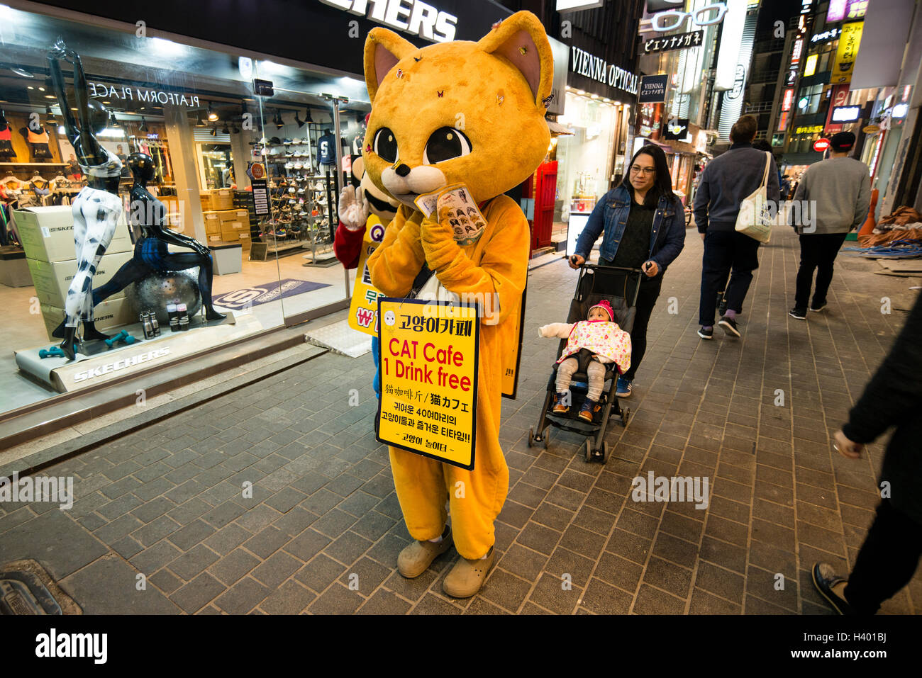 A person dressed up as a cat advertising Cat Cafe in the street of Myeongdong, Seoul, Korea Stock Photo