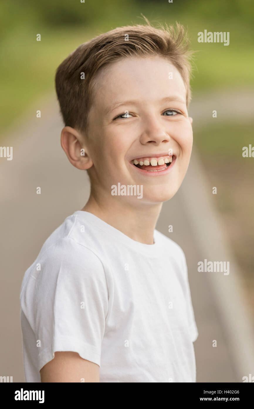 Portrait of cheerful boy at park Stock Photo