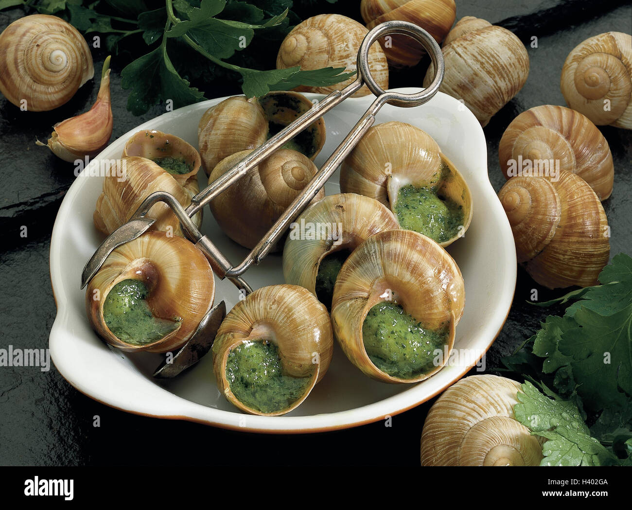 Horsd'oeuvre, edible snails, herbflavoured butter, escargots, larders