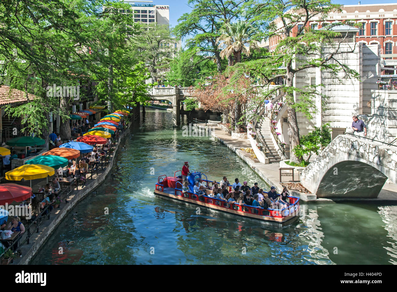 Tourist boat on San Antonio River along the Riverwalk, San Antonio, Texas USA Stock Photo