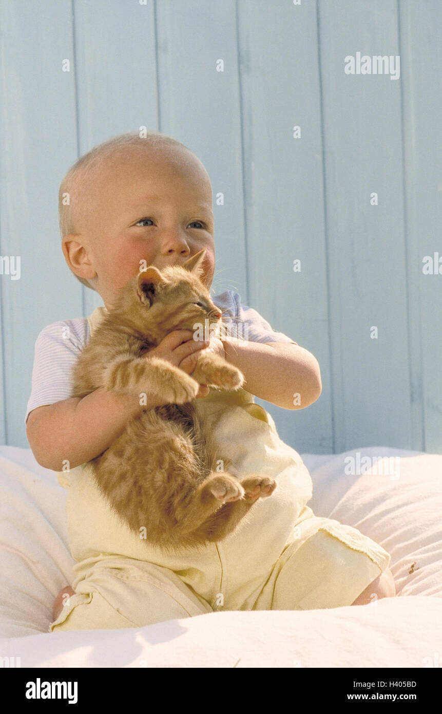 Bed, baby, sit, play kitten, child, infant, 1 year, kneel, childhood, animal, pet, unsuitably, cat, young animal, animal-loving, animal-loving, stroke, cuddle, roughly, play, hold, experience, contact Stock Photo