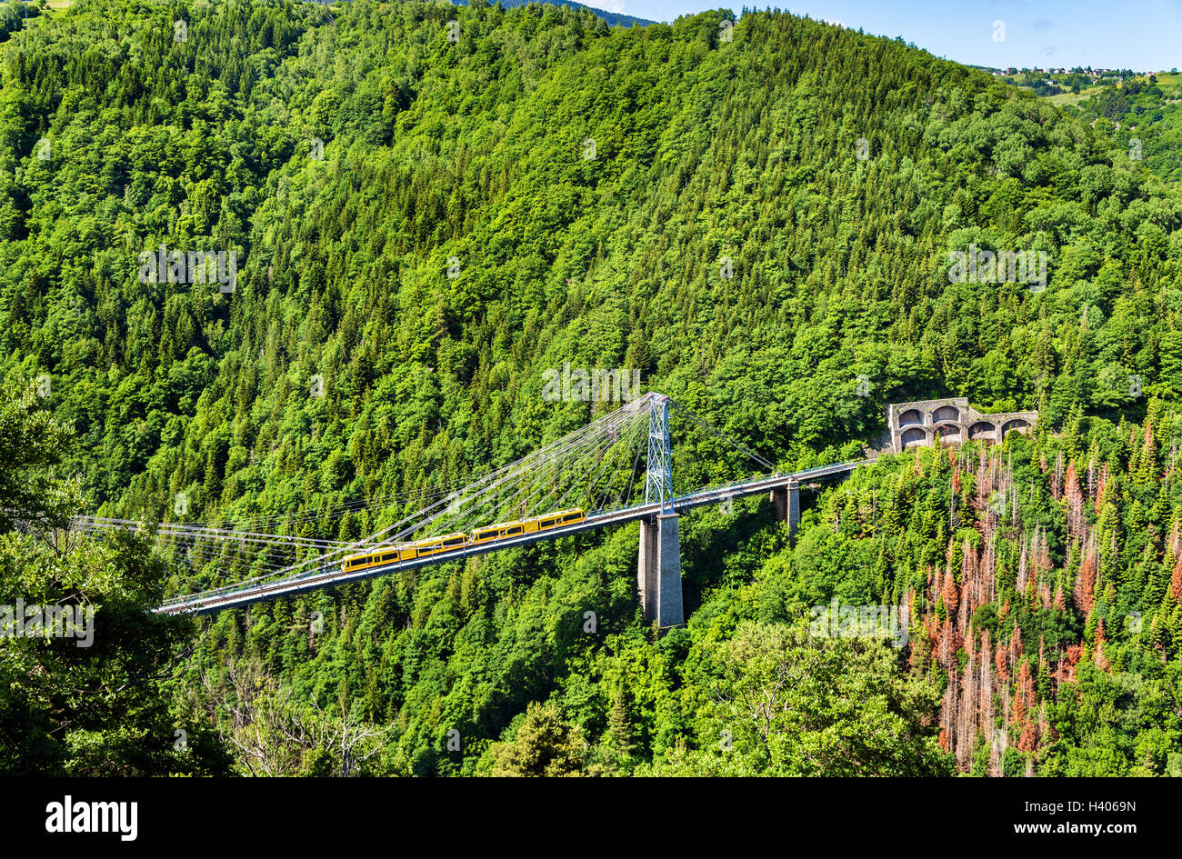 The Yellow Train (Train Jaune) on Cassagne bridge - France, Pyrenees-Orientales Stock Photo