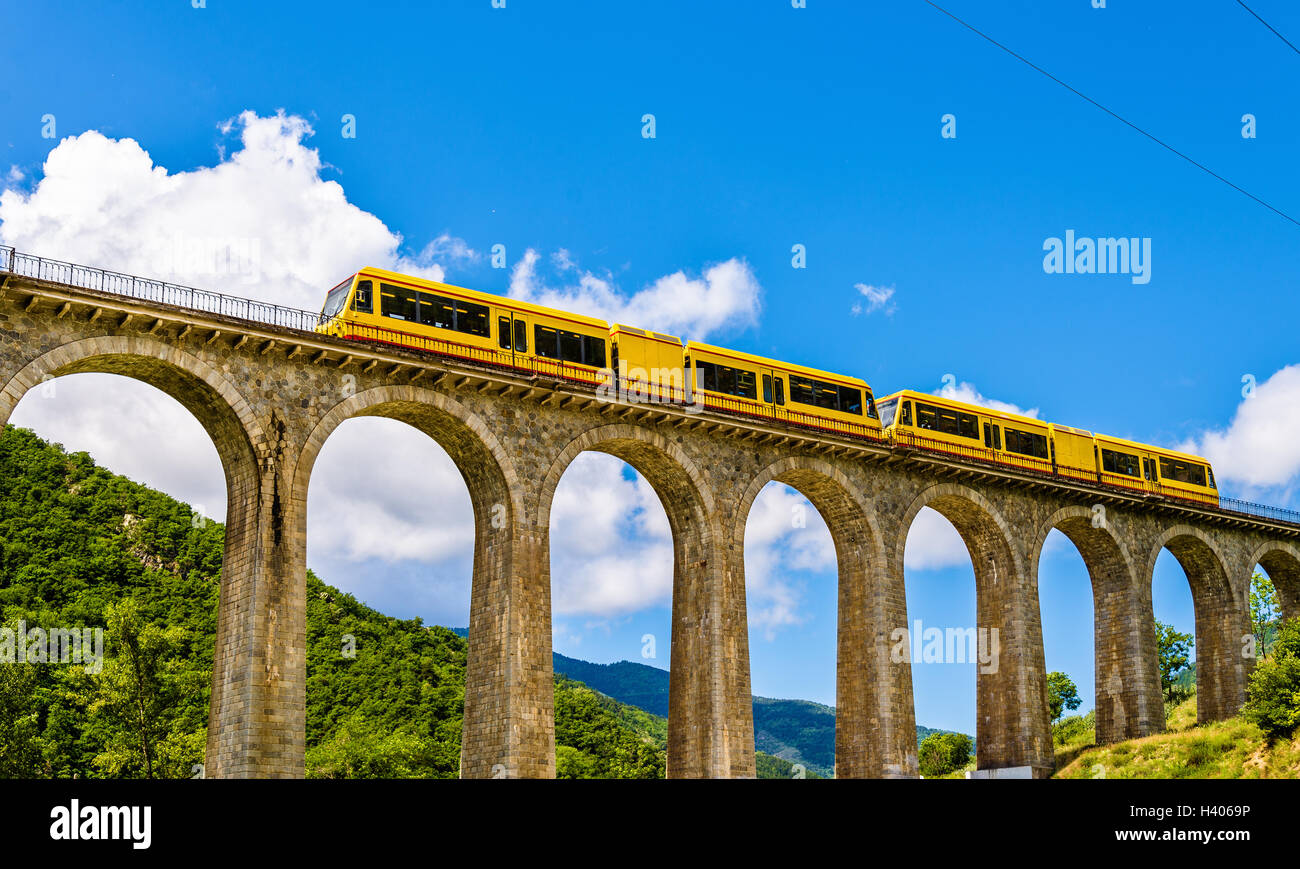 The Yellow Train (Train Jaune) on Sejourne bridge - France, Pyrenees-Orientales Stock Photo