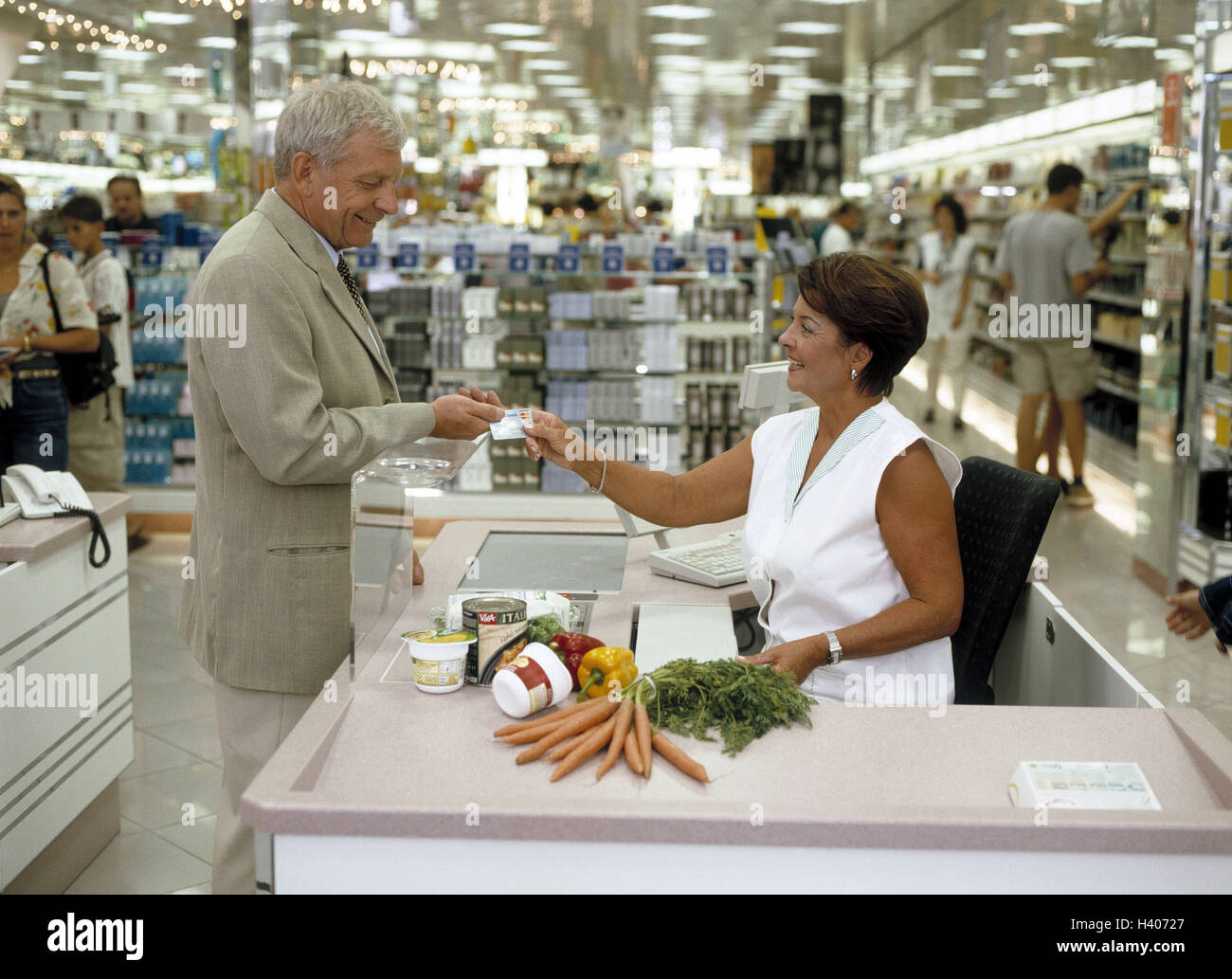 Department store, cash box, man, payment, credit card, senior
